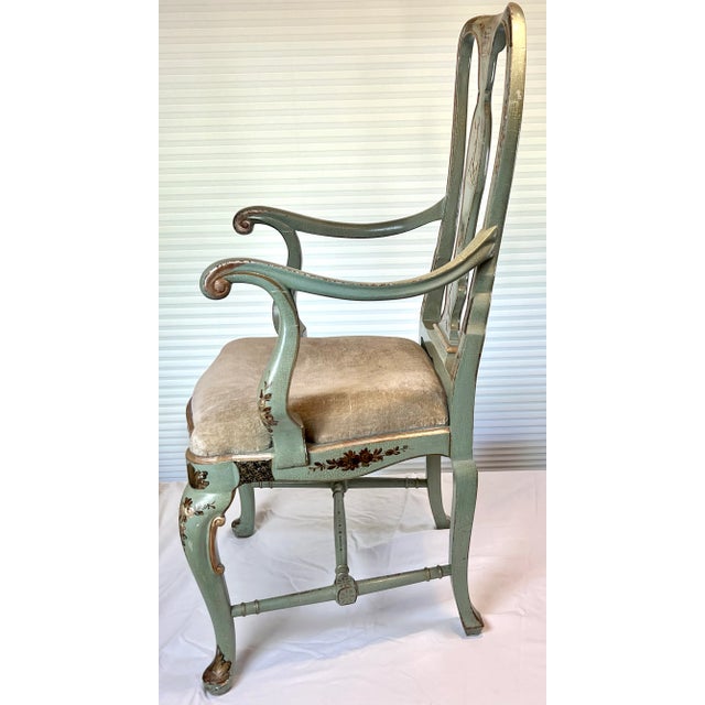 A vintage, high quality, painted chinoiserie arm chair in a beautiful shade of crackled seafoam green, having hand painted...