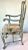 A vintage, high quality, painted chinoiserie arm chair in a beautiful shade of crackled seafoam green, having hand painted...