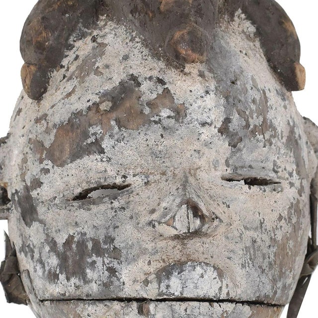 The Ogoni Wood Mask with an Articulating Mouth is a remarkable example of traditional Nigerian craftsmanship, originating...