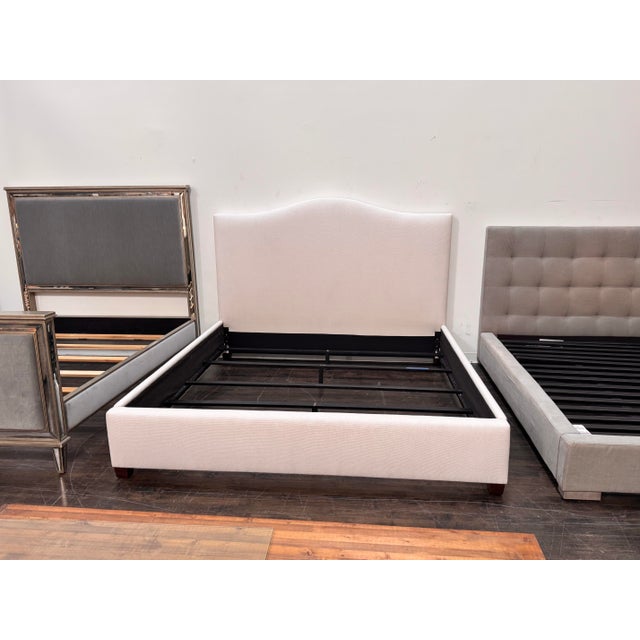 Design Plus Gallery presents an Eastern King Raleigh Bed Frame from Pottery Barn. This upholstered bed is presented in...