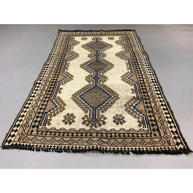 Vintage Traditional Middle East Gabbeh Rug 1950s tribal Gabbeh with traditional diamond pattern on beige background with...