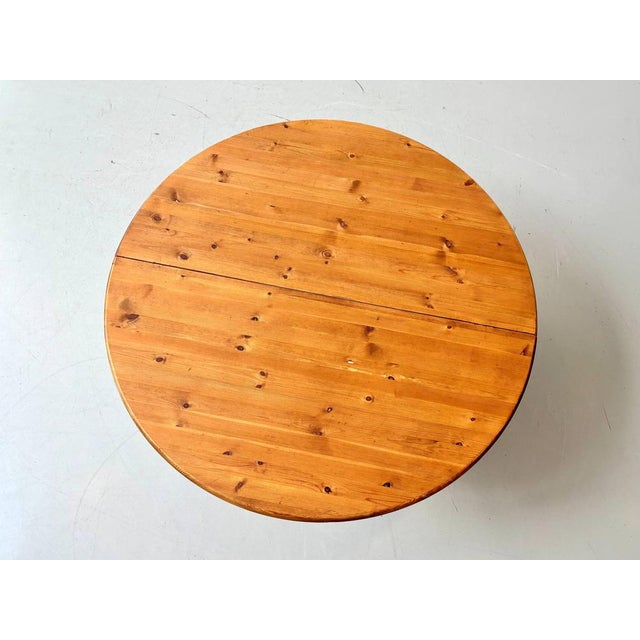 This generously sized dining table impresses with its warm, natural appeal and clean, functional design, typical of the...