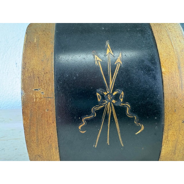 This is a handsome hand painted toleware trinket box. This trinket box has been hand painted black and gold with a...