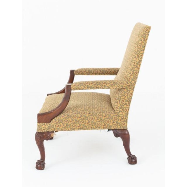 Georgian style mahogany Gainsborough chair This imposing chair stands upon well carved cabriole legs with boldly carved...