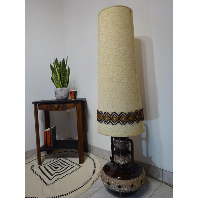 Ceramic lamp base in the shape of an amphora, with double handles and a volcanic stone finish. Twelve holes around the...
