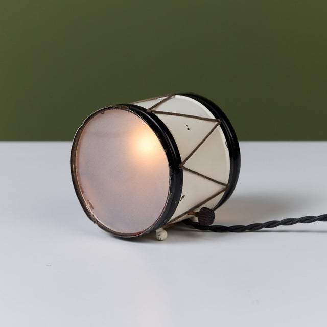 Petite drum lamp by Lurelle Guild for Chase, c.1930s, USA. The Art Deco lamp features an enameled white and black metal...