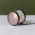 Petite drum lamp by Lurelle Guild for Chase, c.1930s, USA. The Art Deco lamp features an enameled white and black metal...