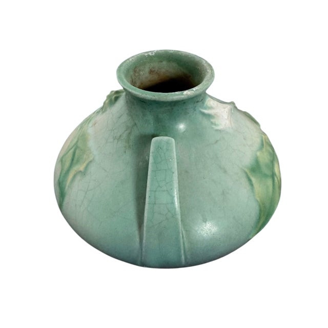 6”Diam x 4”H An exquisite artifact of mid-century American craftsmanship, this low-slung, dual-handled ceramic vase...