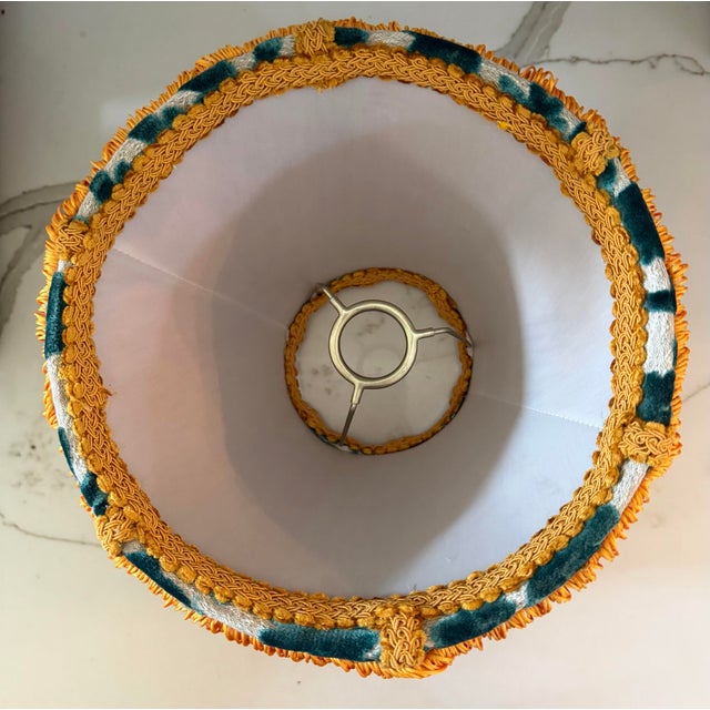 A striking custom lampshade handcrafted in luxurious Covington “Luv Bunny” velvet, featuring whimsical teal bunny...