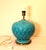 Large table lamp with a curved base in turquoise ceramic with a diamond pattern. The bright turquoise glaze is intact and...