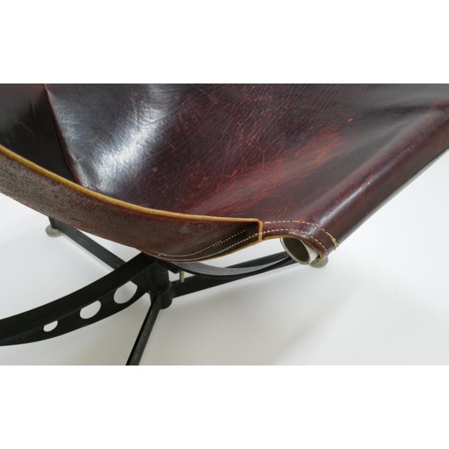 A striking Max Gottschalk steel and leather sling chair, showcasing the designer’s distinctive approach to sculptural...