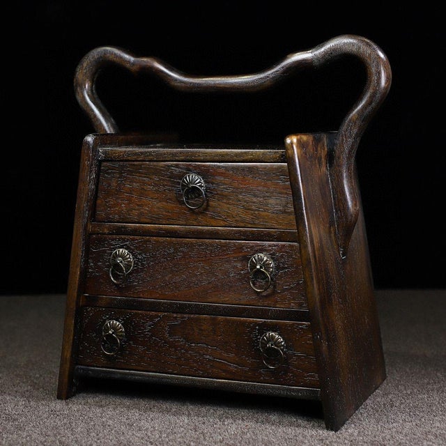 This is a beautiful vintage Chinese tiered box, crafted from solid Huali (Rosewood) wood. The piece features an elegant,...