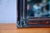 This antique mirror exudes bohemian chic charm! Its frame is adorned with a carefully painted faux wood finish,...