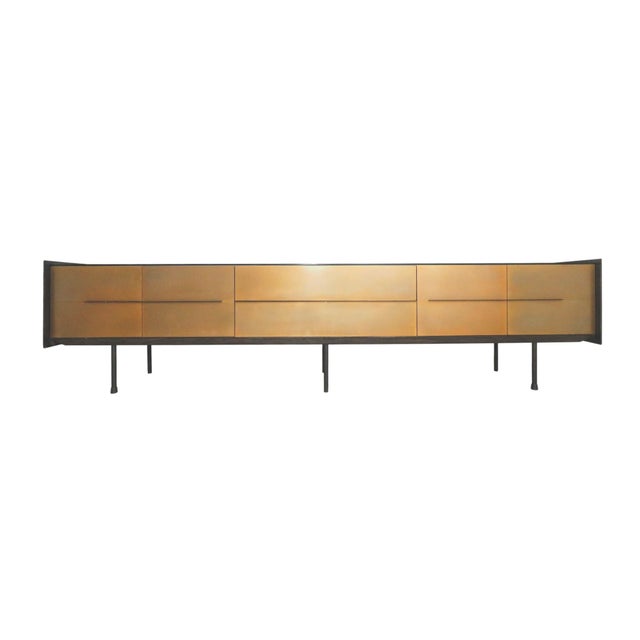 A sleek hand made cantilever sideboard made by Ebony Gallery Cape Town of Franschhoek, South Africa. The richly grained...