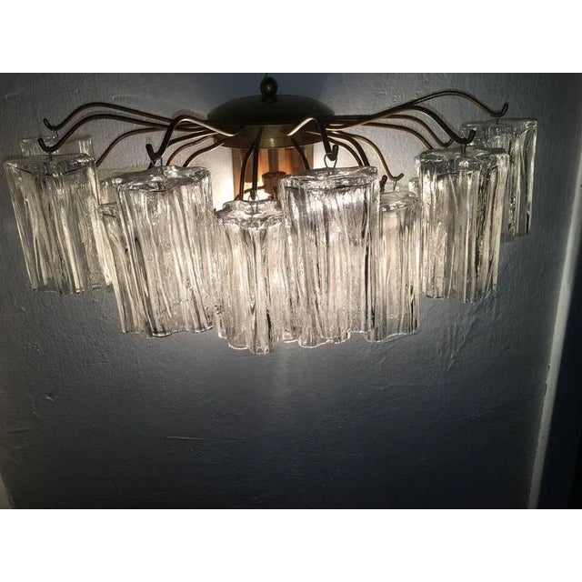 21 hand blown glass tubes on each sconce, each measuring 4.72” long. This piece is attributed to the mentioned...