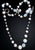 A captivating statement necklace of opaque milk glass and iridescent opaline beads. Woven throughout are intricate floral...