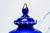 Elevate your décor with this exquisite Victorian lidded vase, a captivating work of hand-blown artistry in rich cobalt...