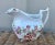 A precious small pitcher excellent for display or functional for creamer or gravy. It features allover Chinoiserie hand...