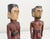 Pair of Mid 20th century carved wooden figures from Kutu Island, Micronesia. Male and Female figures each depicted with...