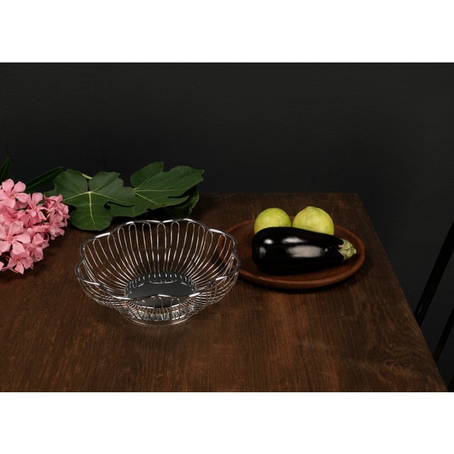 This lightweight, timeless fruit basket crafted from bent metal wire in the Mid Century Modern style combines functional...