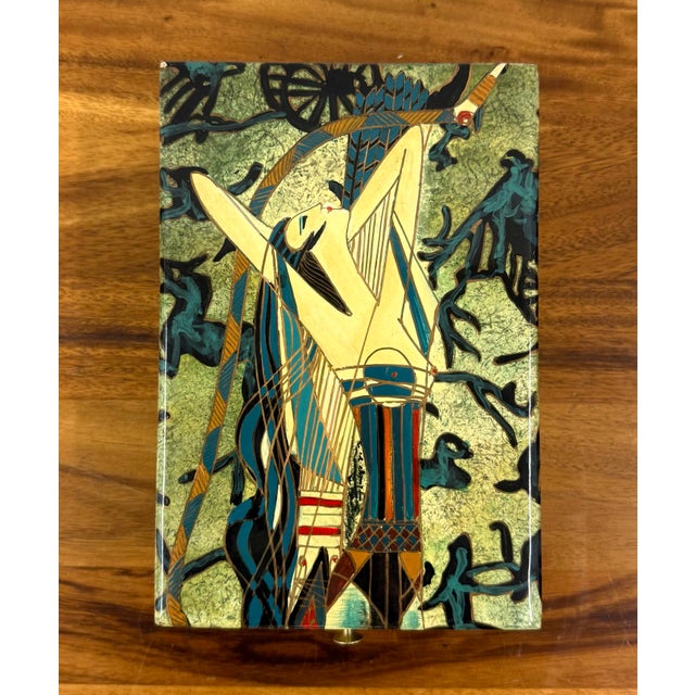 A distinctive vintage decorative box featuring imagery from Ting Shao Kuang’s celebrated 1989 work Huntress. The design...