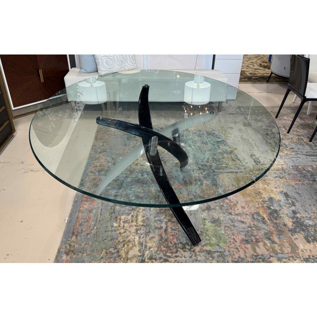 A gorgeous Art Glass dining table base in black and frosted white glass, supporting an oval glass top with a beveled edge....
