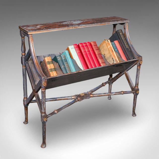 This is an antique Georgian revival book trough. An English, painted mahogany library stand, dating to the Edwardian...