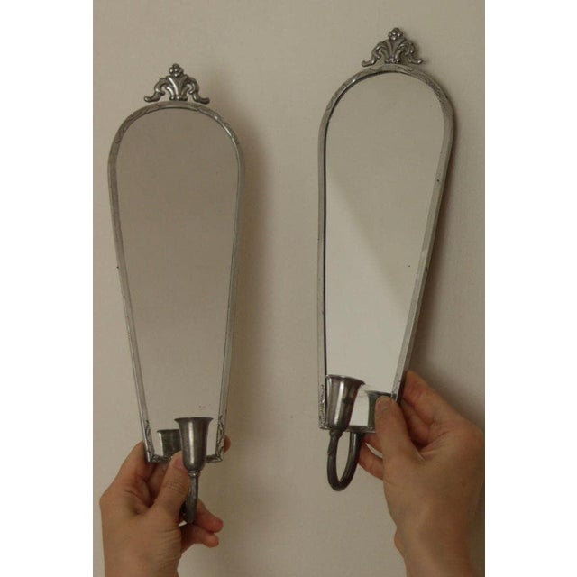 Pair of Mid Century Swedish Pewter Sconces by Svenskt Tenn These are pewter mirror wall sconces by Svenskt Tenn, featuring...