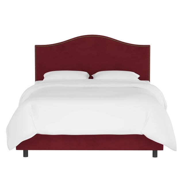 Give your interior a lift with the Bed. Featuring the delicate curves of a classic camelback design, with subtle nailhead...