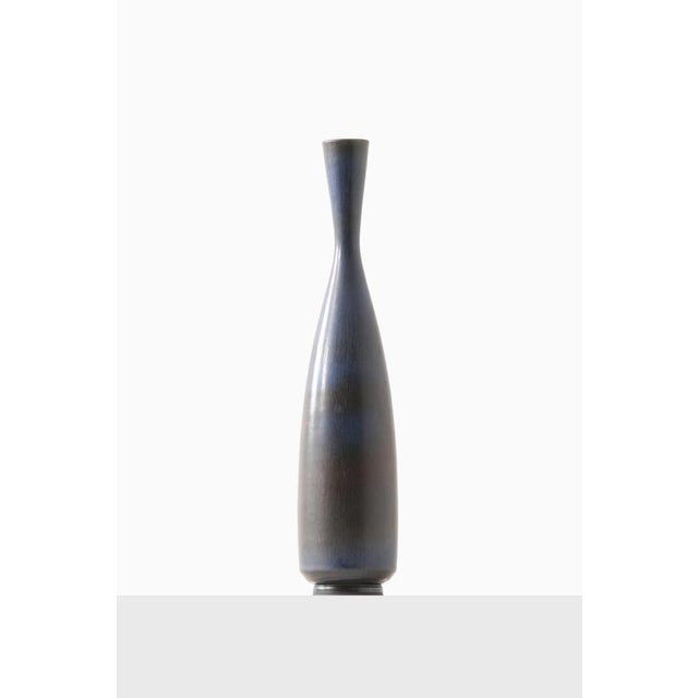 This rare and large ceramic vase, designed by Berndt Friberg and produced by Gustavsberg in Sweden, is an exemplary work...