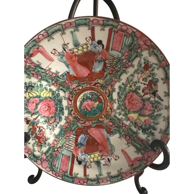 A set of 2 Chinese Porcelain Rose Medallion Plates. Plates are pink, green, blue, yellow, and rust, with intricate hand-...