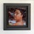 In "Queens Departure," a figure gazes directly at the viewer, exuding a sense of strength and introspection. The rich oil...