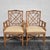 This Chinese Chippendale style set consists of four faux bamboo armchairs, each featuring rattan fretwork on chair backs,...