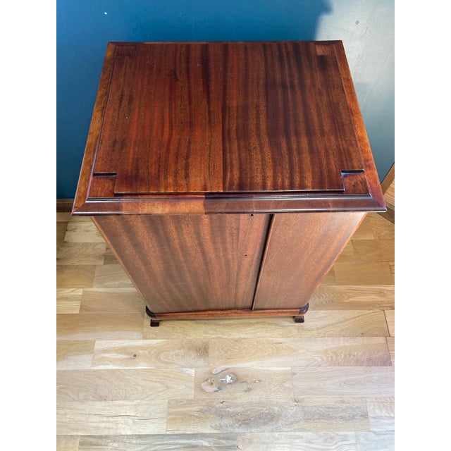 Labeled made in 1914. This unique cabinet spins to hold records. It is well made of solid wood and makes a beautiful...