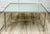 Here is a fabulous vintage Neoclassical coffee table in the style of Maison Jansen, likely dating to the later 20th...
