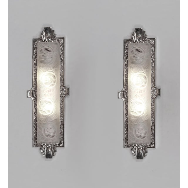 Degué A beautiful pair of authentic 1930 French art deco wall sconces in nickel plated solid brass or bronze holding two...