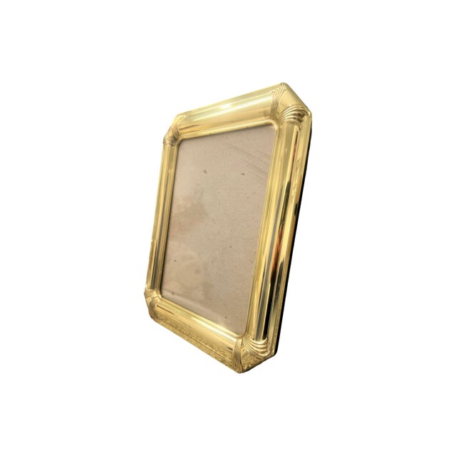 We have for your consideration a very gorgeous solid brass art deco style l picture frame dating from around the 1980s to...
