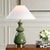 The Green Thumb Table Lamp Offers Both Versatility And Sophisticated Style. The Moss Green Ceramic Base Adds A Subtle Pop...
