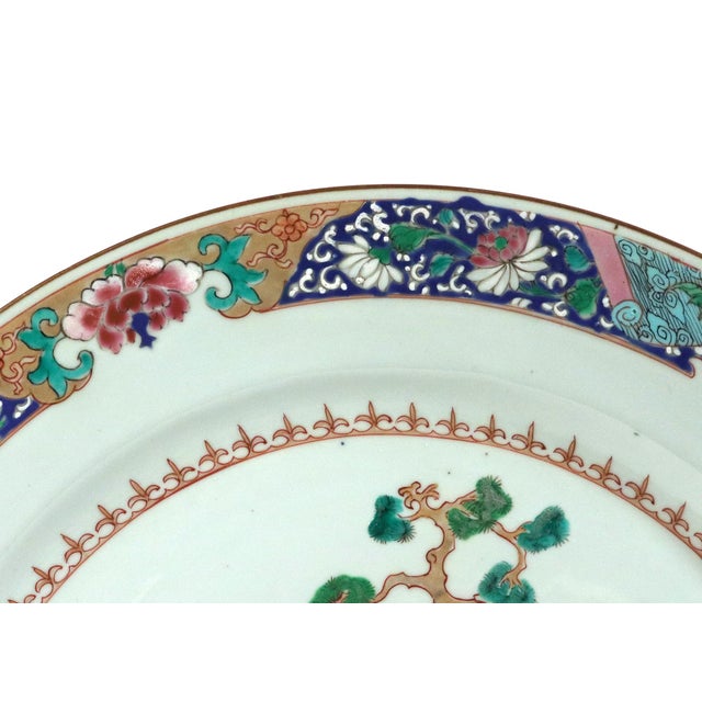Chinese Export Famille Rose "Garden" Dishes, Pair Qianlong Period, Circa 1740–1760 An attractive pair of large circular...