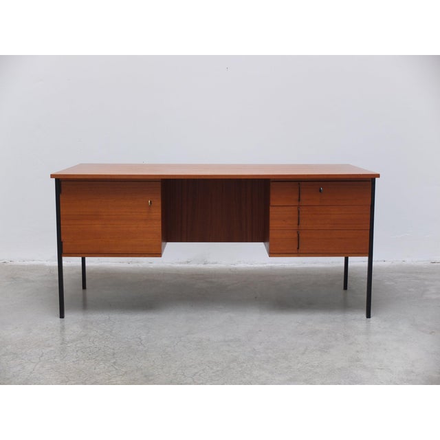 Timeless desk designed by Günter Renkel for REGO Möbel around 1960. Made of teak wood combined with black metal legs and...