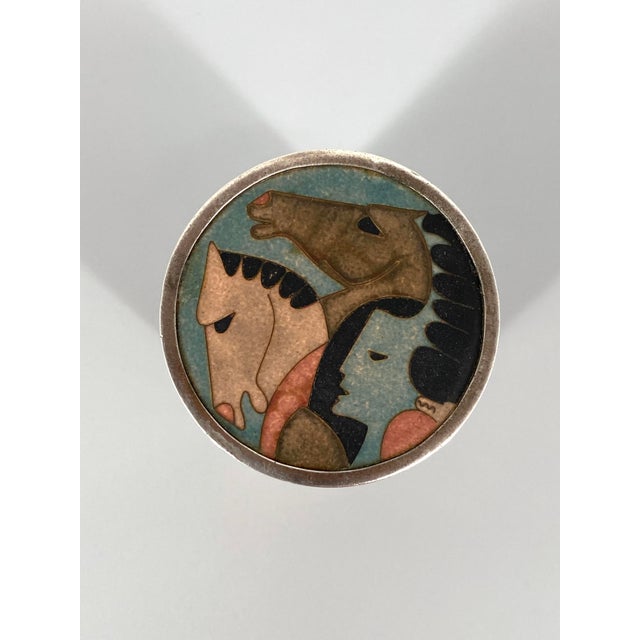 A cigarette case * Cylindrical shape * Lid with enamel inlay * Signed enamel inlay, see photos * High-quality design: a...