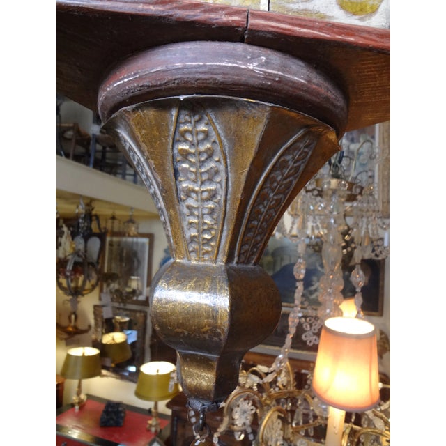 Fabulous carved and painted wood Italian lantern with three gilded tole leaf crown. Painted in red and white with gold...
