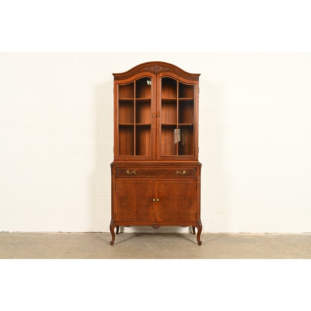A gorgeous French Provincial Louis XV style breakfront bookcase, dining cabinet, or bar cabinet By Romweber Retailed by...