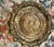 Offering highly decorative antique brass pedestal table featuring an intricately pierced and repoussé-style round top. The...