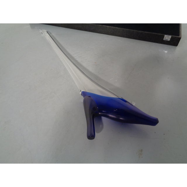 Glass object in the shape of a boot. Original case with a recess into which the boot fits. Double marked with Playboy. The...