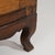 A Louis XV corner cabinet designed to fit into angled spaces. The front features a curved profile with paneled...