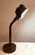 This Mod gooseneck lamp is by Lightolier featuring a brown metal base, hood shade, and the arm section is black flex...