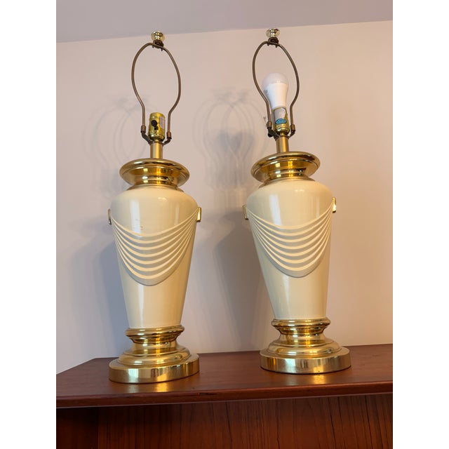Elevate your space with this gorgeous, matched pair of vintage 1970s/1980s Hollywood Regency urn-form table lamps....
