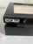 Designed for organizing and protecting fine eyewear, this OYOBox features a sleek, high-gloss black lacquer finish with a...