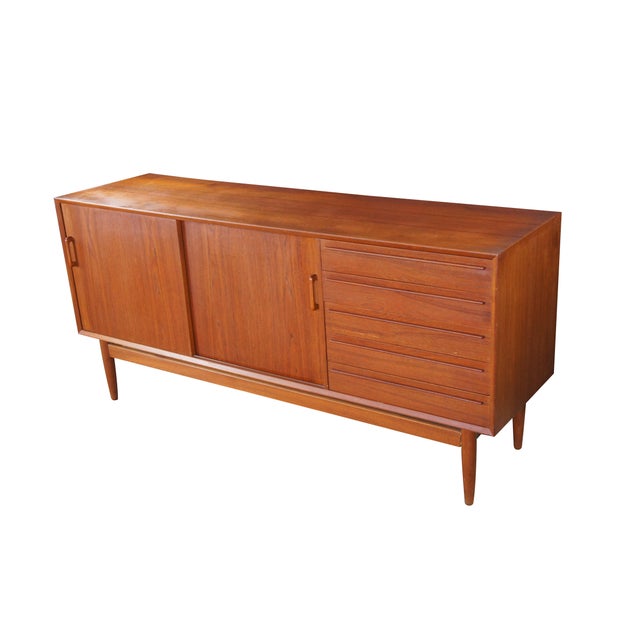 Otmar Furniture Danish Scandinavian Modern Credenza, circa 1980. Features a minimalist sleek rectangular form with sliding...